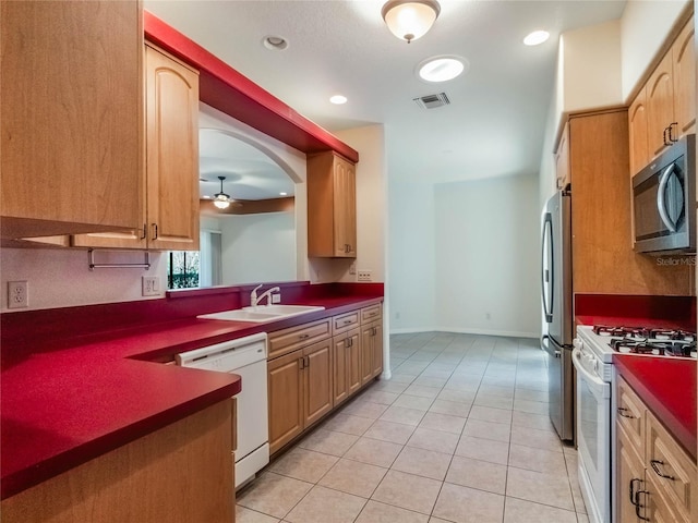 27307 Pine Straw Rd, Leesburg, FL 34748 - kitchen with a sink, visible vents, dark countertops, and appliances with stainless steel finishes