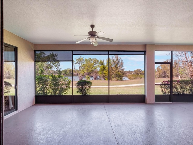27307 Pine Straw Rd, Leesburg, FL 34748 - unfurnished sunroom with a water view and a ceiling fan