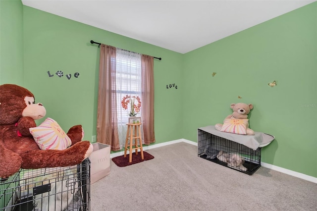 interior space with carpet flooring and baseboards