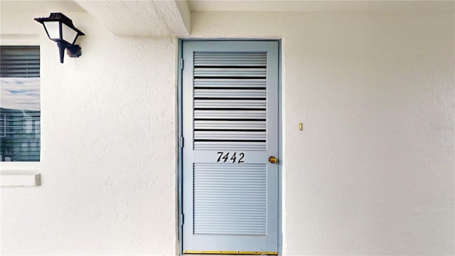 exterior details featuring stucco siding