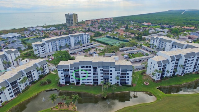 drone / aerial view featuring a water view and a view of city