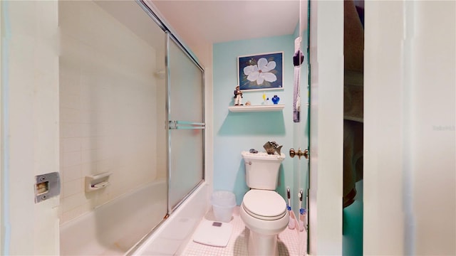 bathroom with tile patterned flooring, enclosed tub / shower combo, and toilet