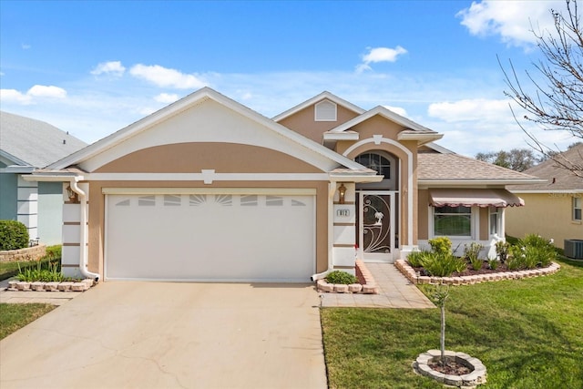 view of front of house featuring a garage, concrete driveway, roof with shingles, and stucco siding