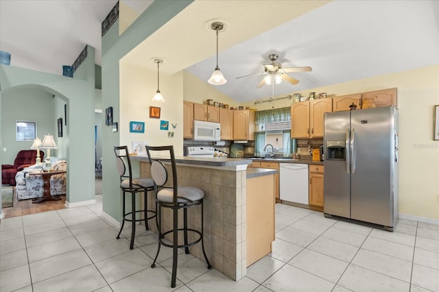 kitchen featuring dark countertops, white appliances, light tile patterned flooring, and ceiling fan