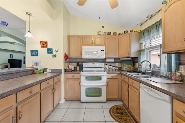 kitchen featuring light tile patterned floors, lofted ceiling, white appliances, a sink, and dark countertops