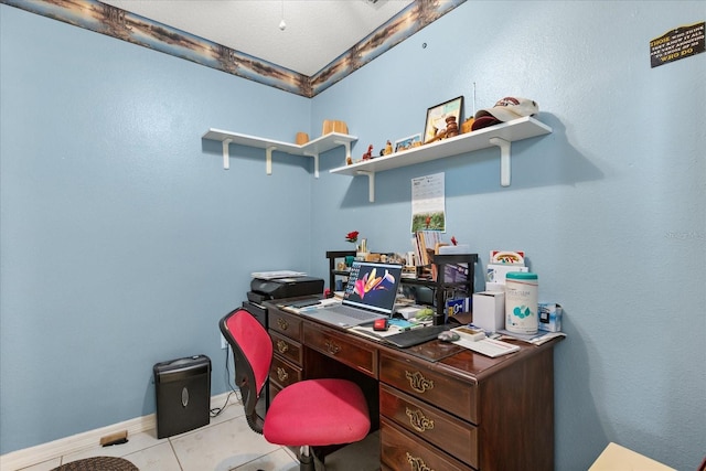 office space featuring light tile patterned flooring and baseboards