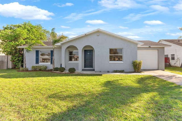 ranch-style house featuring driveway, a garage, stucco siding, fence, and a front yard