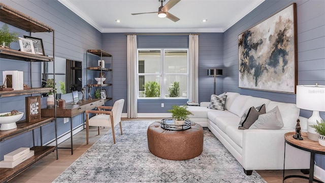 living area featuring ceiling fan, ornamental molding, wood finished floors, and recessed lighting