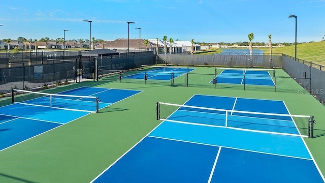 view of sport court featuring community basketball court and fence