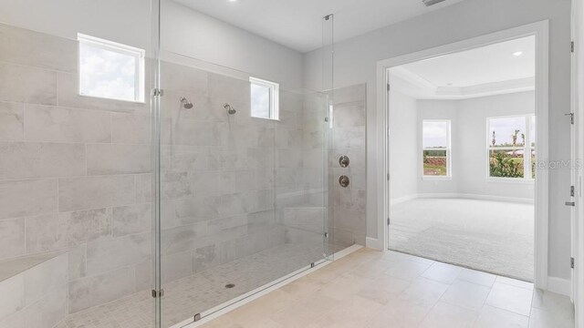 5641 Nevis Ter, Kissimmee, FL 34758 - bathroom with a tile shower, baseboards, and recessed lighting