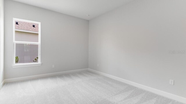5641 Nevis Ter, Kissimmee, FL 34758 - carpeted spare room with baseboards