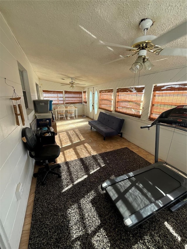 interior space with a porch and ceiling fan