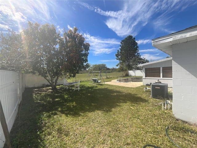 view of yard with a fenced backyard and cooling unit