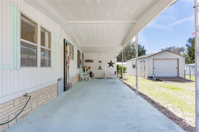 view of patio featuring an outbuilding and a storage shed