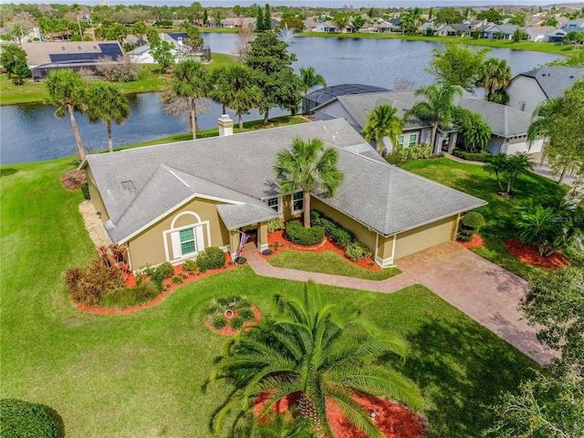 drone / aerial view with a residential view and a water view