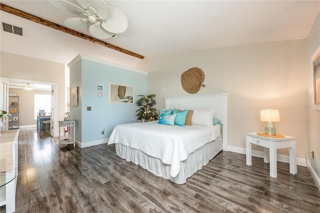 bedroom with lofted ceiling, visible vents, a textured ceiling, wood finished floors, and baseboards