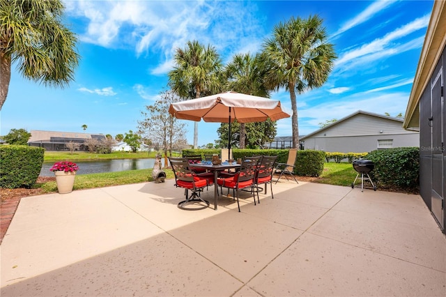 view of patio / terrace featuring a water view and outdoor dining space