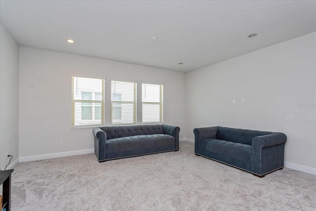 15724 Cutter Sail Pl, Winter Garden, FL 34787 - living area featuring a textured ceiling, baseboards, carpet flooring, and recessed lighting