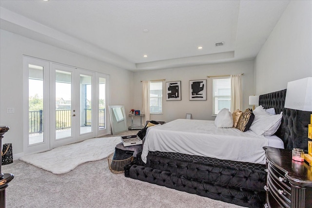 15724 Cutter Sail Pl, Winter Garden, FL 34787 - carpeted bedroom with access to exterior, recessed lighting, a raised ceiling, visible vents, and baseboards