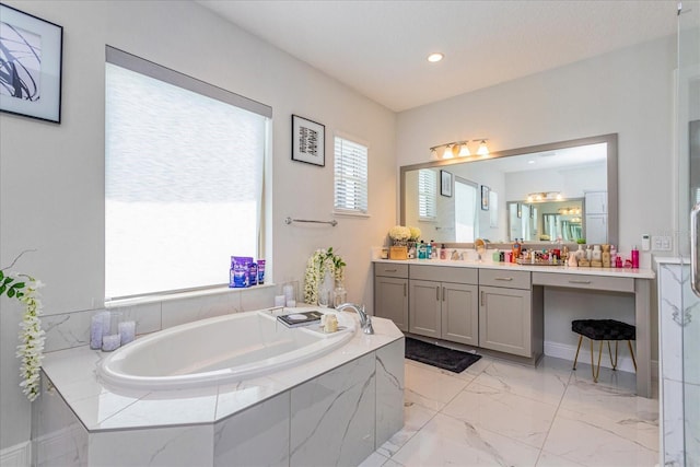 15724 Cutter Sail Pl, Winter Garden, FL 34787 - bathroom featuring marble finish floor, vanity, a bath, and recessed lighting