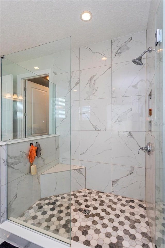15724 Cutter Sail Pl, Winter Garden, FL 34787 - bathroom with recessed lighting, a textured ceiling, and a marble finish shower