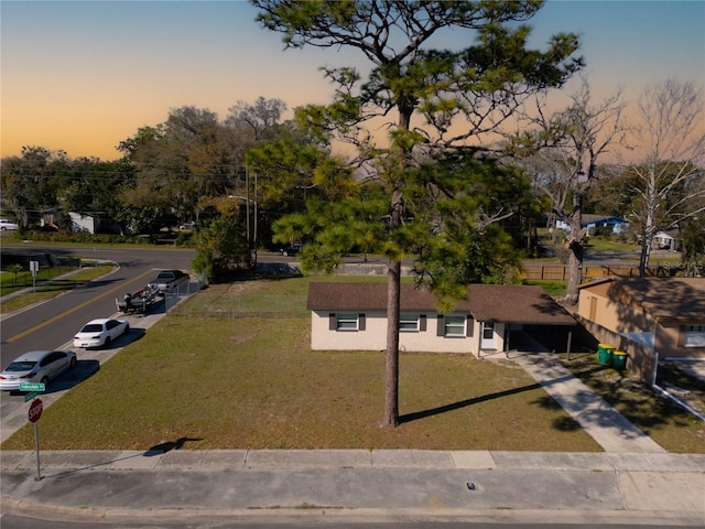 view of front of house with a front lawn and stucco siding