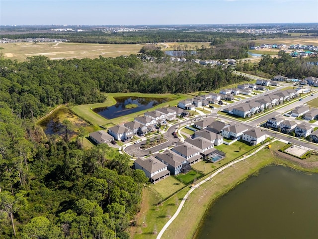 bird's eye view featuring a water view, a residential view, and a view of trees