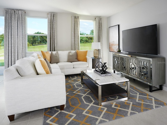 living room featuring tile patterned flooring and a healthy amount of sunlight