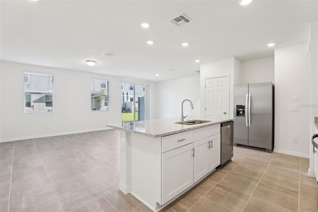4365 Switchgrass Ln, Saint Cloud, FL 34772 - kitchen featuring visible vents, a sink, appliances with stainless steel finishes, recessed lighting, and light stone countertops