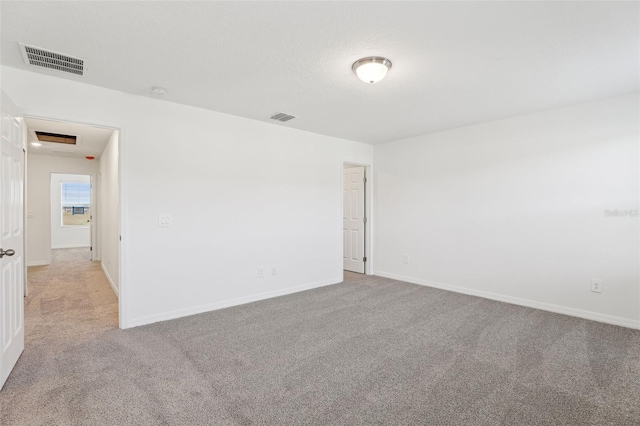 4365 Switchgrass Ln, Saint Cloud, FL 34772 - spare room with visible vents, baseboards, and light carpet