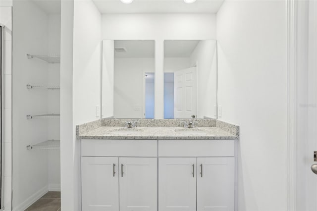 4365 Switchgrass Ln, Saint Cloud, FL 34772 - full bath with a sink, baseboards, and double vanity