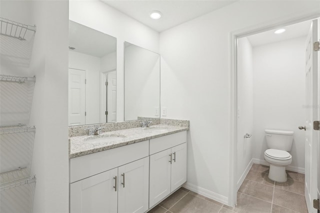 4365 Switchgrass Ln, Saint Cloud, FL 34772 - full bath with tile patterned floors, double vanity, a sink, and toilet