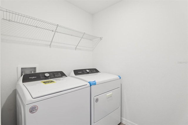 4365 Switchgrass Ln, Saint Cloud, FL 34772 - clothes washing area featuring separate washer and dryer, laundry area, and baseboards