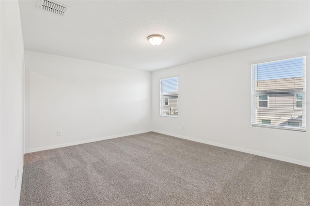4365 Switchgrass Ln, Saint Cloud, FL 34772 - empty room with carpet flooring, visible vents, and baseboards