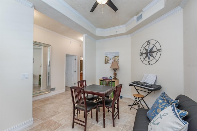 3203 S Washington Ave Unit 1002, Titusville, FL 32780 - dining room with baseboards, visible vents, ornamental molding, and a tray ceiling
