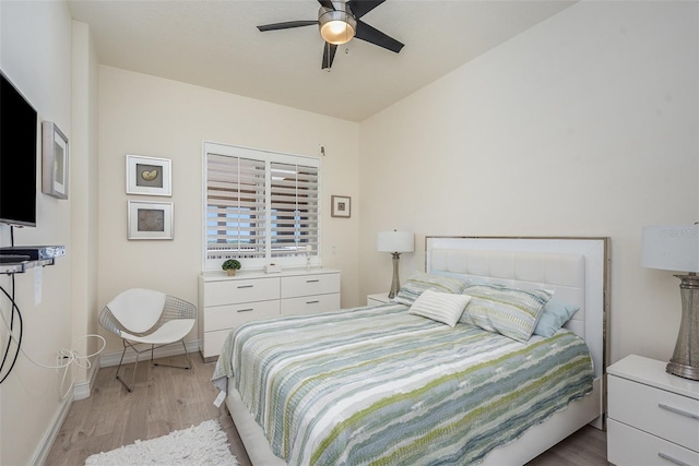 3203 S Washington Ave Unit 1002, Titusville, FL 32780 - bedroom featuring light wood-style floors, baseboards, and a ceiling fan