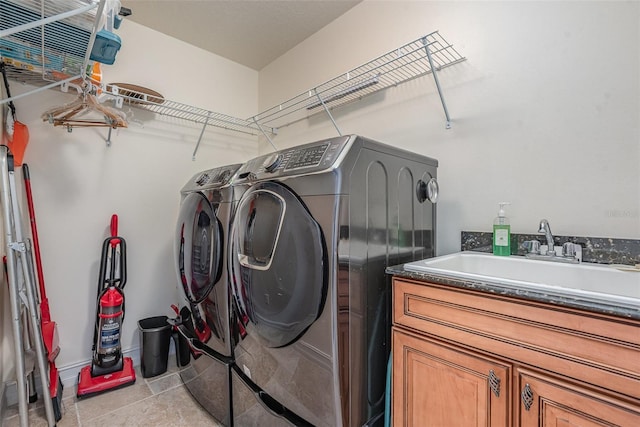 3203 S Washington Ave Unit 1002, Titusville, FL 32780 - laundry area with cabinet space, a sink, and washer and clothes dryer