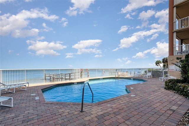 3203 S Washington Ave Unit 1002, Titusville, FL 32780 - pool featuring a water view, a patio, and fence