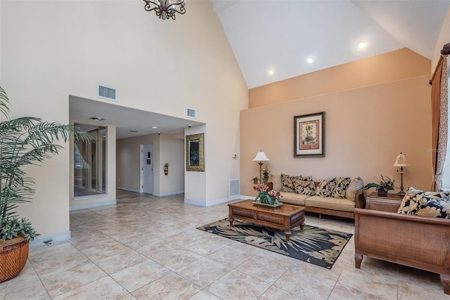 3203 S Washington Ave Unit 1002, Titusville, FL 32780 - living area with lofted ceiling, visible vents, and baseboards