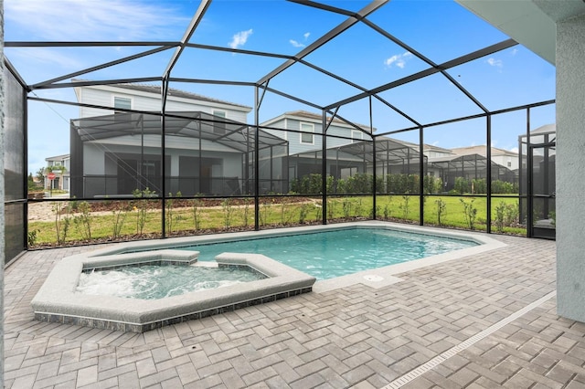 view of swimming pool featuring a lanai and a patio