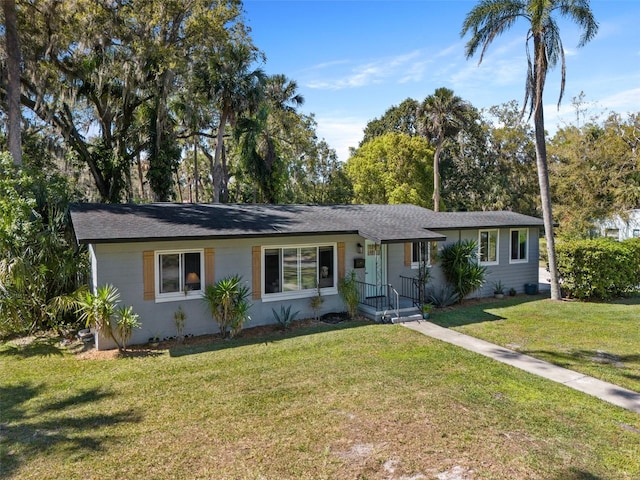 single story home with a front yard