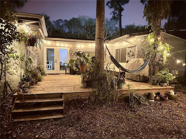 exterior space with french doors and a wooden deck