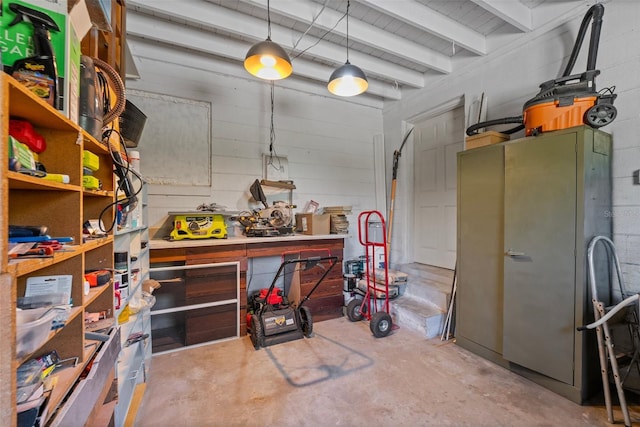 interior space with a workshop area and concrete block wall