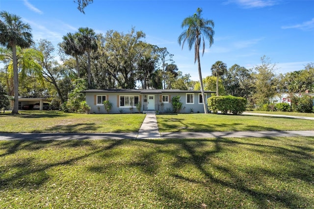 ranch-style home featuring a front lawn