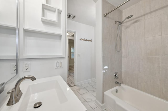 full bath with shower / bath combination, a sink, visible vents, baseboards, and marble finish floor