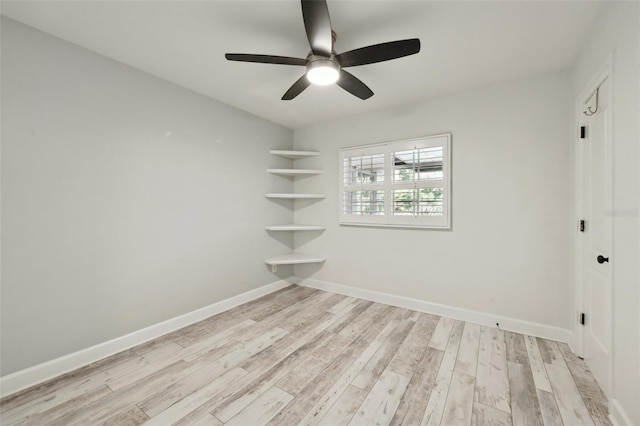 empty room with light wood-style flooring, baseboards, and ceiling fan