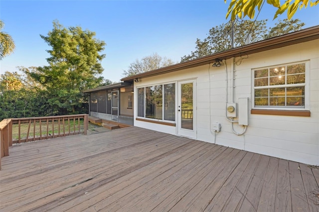 deck with a sunroom