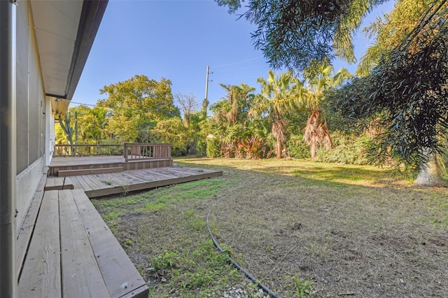 view of yard with a deck