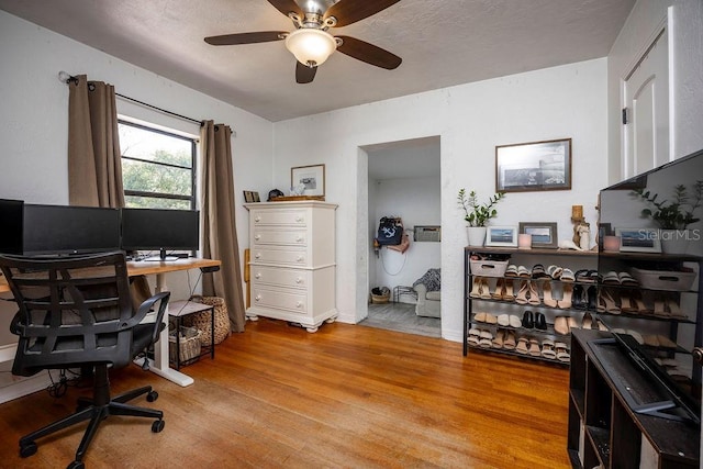 office space featuring ceiling fan and wood finished floors