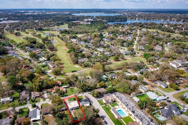 drone / aerial view featuring a water view and a residential view